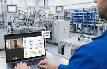 Plant manager with a laptop in a factory setting
